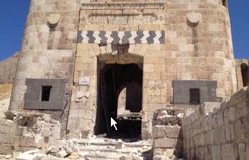 The Citadel of Aleppo. damage to the outer portal, the front gate